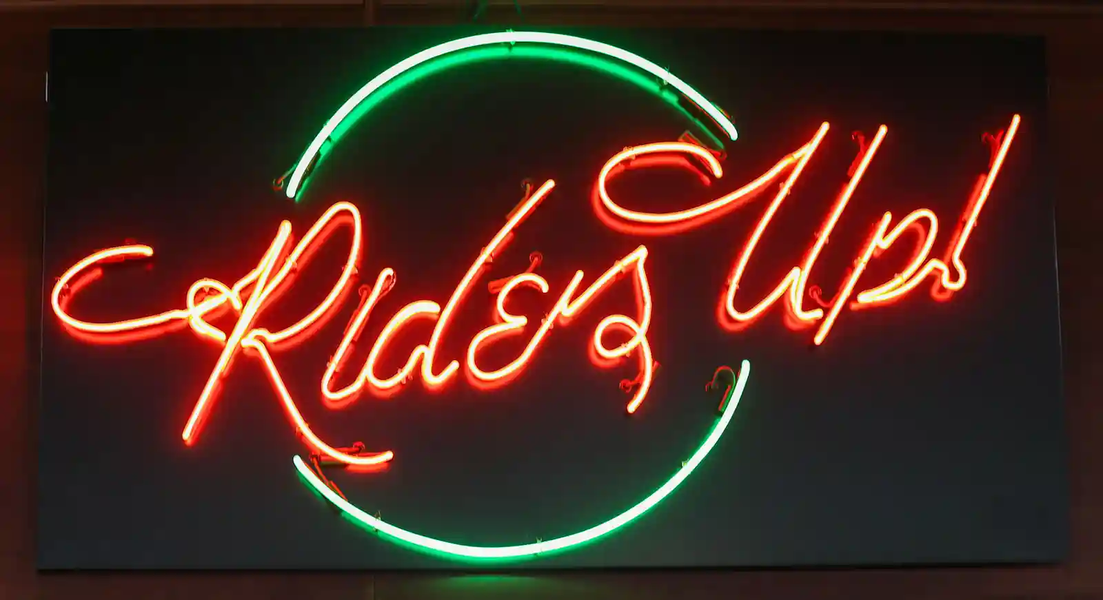 Riders Up neon sign up close